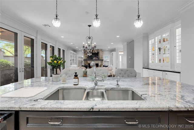 4829 S Zunis Ave, Tulsa, OK 74105 - kitchen with visible vents, open floor plan, crown molding, and plenty of natural light
