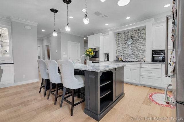 4829 S Zunis Ave, Tulsa, OK 74105 - kitchen with recessed lighting, light wood-style flooring, white cabinets, ornamental molding, and backsplash