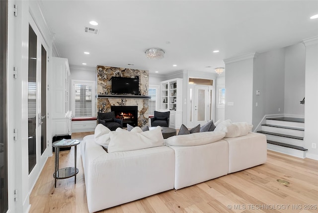 4829 S Zunis Ave, Tulsa, OK 74105 - living area with visible vents, ornamental molding, and a stone fireplace