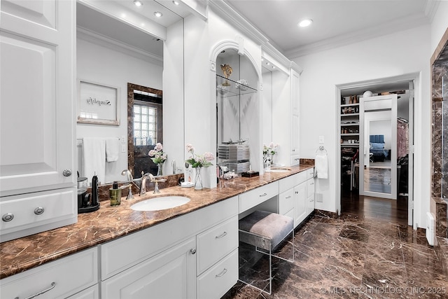 4829 S Zunis Ave, Tulsa, OK 74105 - bathroom with a spacious closet, recessed lighting, crown molding, and marble finish floor