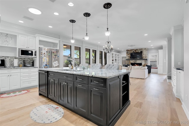 4829 S Zunis Ave, Tulsa, OK 74105 - kitchen featuring open shelves, appliances with stainless steel finishes, white cabinetry, visible vents, and crown molding