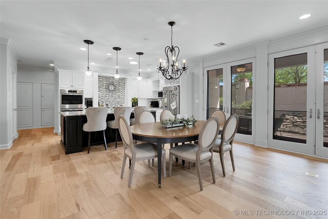 4829 S Zunis Ave, Tulsa, OK 74105 - dining space with recessed lighting, visible vents, and light wood-style floors