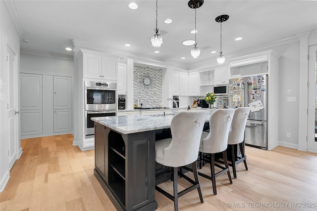 4829 S Zunis Ave, Tulsa, OK 74105 - kitchen with appliances with stainless steel finishes, white cabinetry, open shelves, and crown molding