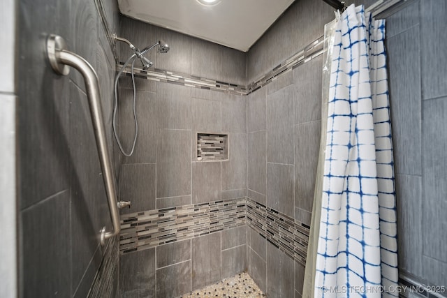 full bathroom with tiled shower