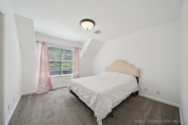 carpeted bedroom with visible vents and baseboards