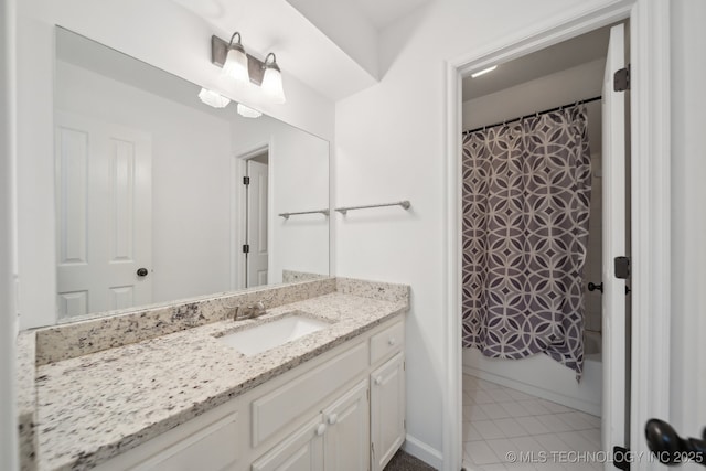 full bath featuring vanity, tile patterned flooring, and shower / bath combo with shower curtain
