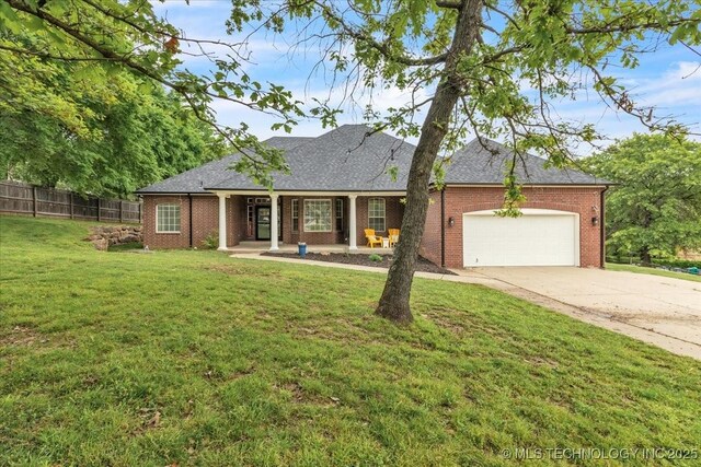 13215 E 182nd Cir, Bixby, OK 74008 - ranch-style house with brick siding, an attached garage, concrete driveway, and a shingled roof