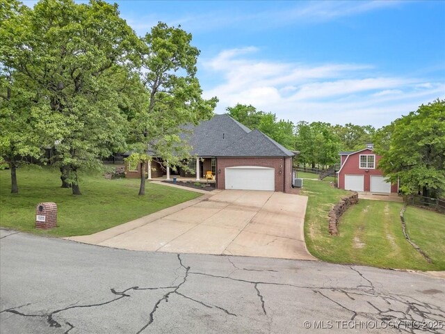 13215 E 182nd Cir, Bixby, OK 74008 - view of front of home with a front yard, concrete driveway, and brick siding