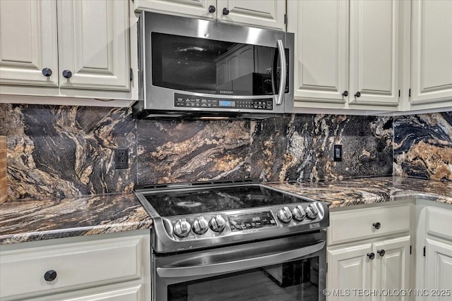 13215 E 182nd Cir, Bixby, OK 74008 - kitchen with stainless steel appliances, backsplash, white cabinets, and dark stone countertops