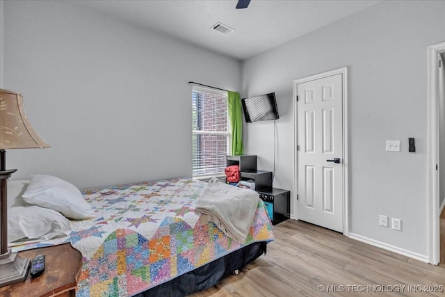 13215 E 182nd Cir, Bixby, OK 74008 - bedroom featuring wood finished floors, baseboards, and a ceiling fan