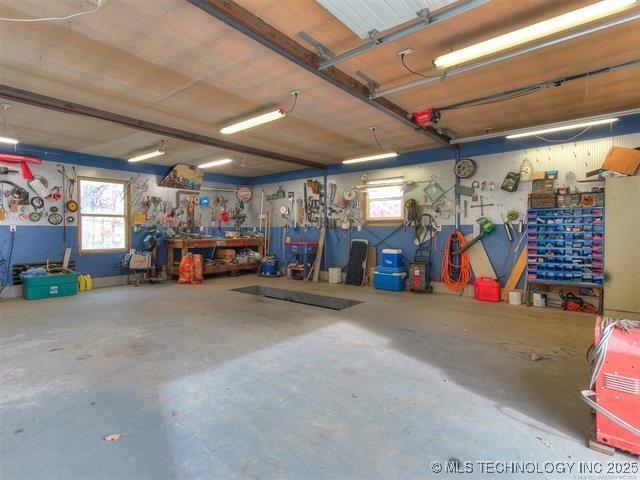 13215 E 182nd Cir, Bixby, OK 74008 - garage with a workshop area