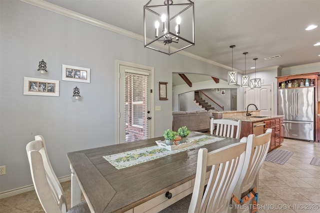 14530 S Gary Pl, Bixby, OK 74008 - dining area with visible vents, stairway, arched walkways, and a notable chandelier