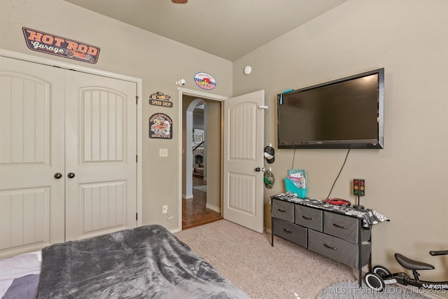 14530 S Gary Pl, Bixby, OK 74008 - bedroom featuring arched walkways, carpet floors, and a closet