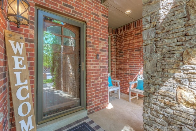 14530 S Gary Pl, Bixby, OK 74008 - view of exterior entry featuring brick siding and a porch