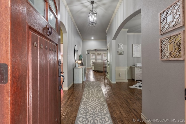 14530 S Gary Pl, Bixby, OK 74008 - hallway with ornamental molding, arched walkways, and dark wood-style flooring