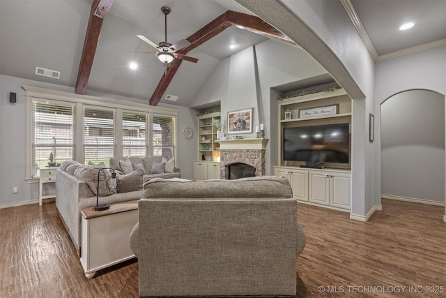 14530 S Gary Pl, Bixby, OK 74008 - living room featuring ceiling fan, visible vents, baseboards, arched walkways, and a fireplace