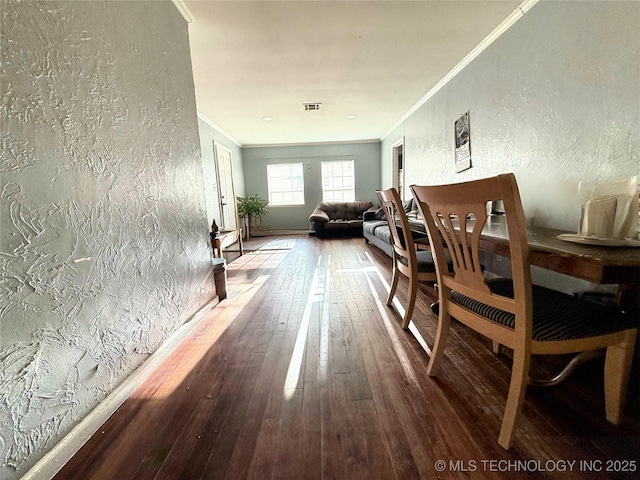1921 N Norwood Ave, Tulsa, OK 74115 - hallway with visible vents, a textured wall, hardwood / wood-style floors, and ornamental molding
