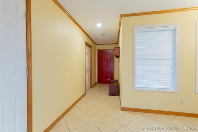 hall featuring light tile patterned floors, recessed lighting, ornamental molding, and baseboards