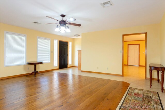 2284 E Roping Rd, Atoka, OK 74525 - empty room with a ceiling fan and light wood finished floors