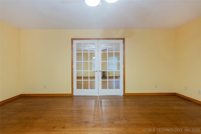 2284 E Roping Rd, Atoka, OK 74525 - spare room with french doors and wood finished floors