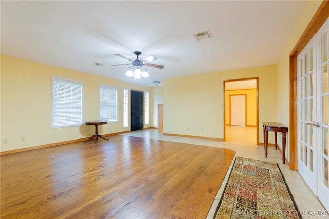 2284 E Roping Rd, Atoka, OK 74525 - empty room with a ceiling fan, light wood-style flooring, and baseboards