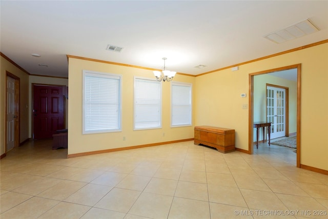 unfurnished room with ornamental molding, visible vents, and a chandelier