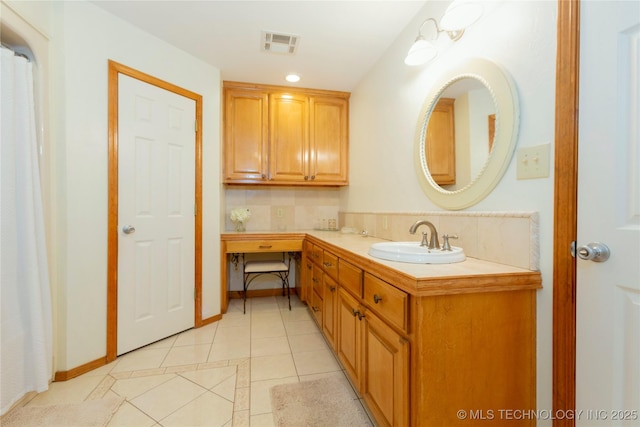 full bathroom with visible vents, vanity, decorative backsplash, and tile patterned flooring