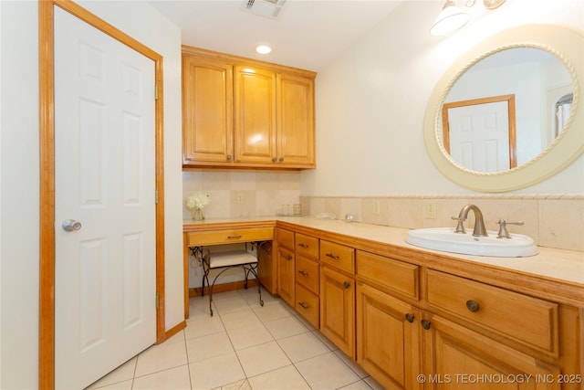 bathroom featuring tile patterned flooring, decorative backsplash, double vanity, a sink, and visible vents