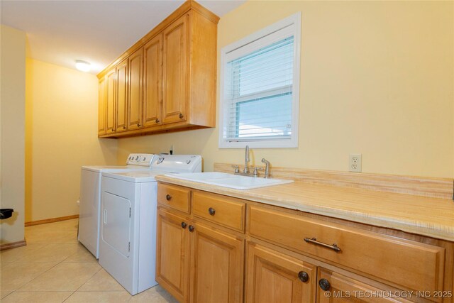 2284 E Roping Rd, Atoka, OK 74525 - laundry area with washer and dryer, cabinet space, and light tile patterned flooring