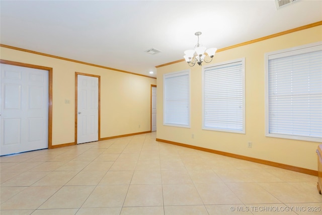 unfurnished room with crown molding, visible vents, a chandelier, and baseboards