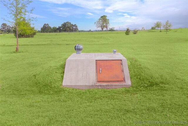 2284 E Roping Rd, Atoka, OK 74525 - view of storm shelter featuring a lawn and a view of countryside