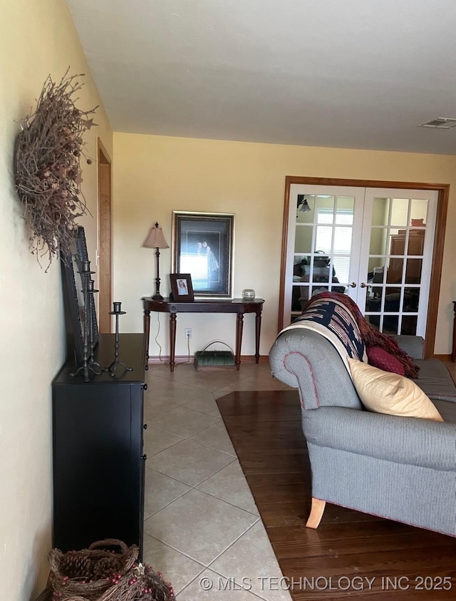 2284 E Roping Rd, Atoka, OK 74525 - living area with french doors and light tile patterned floors
