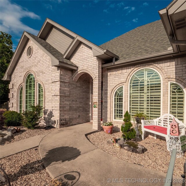1904 Sandpiper St, Mcalester, OK 74501 - view of front of property featuring a shingled roof and brick siding