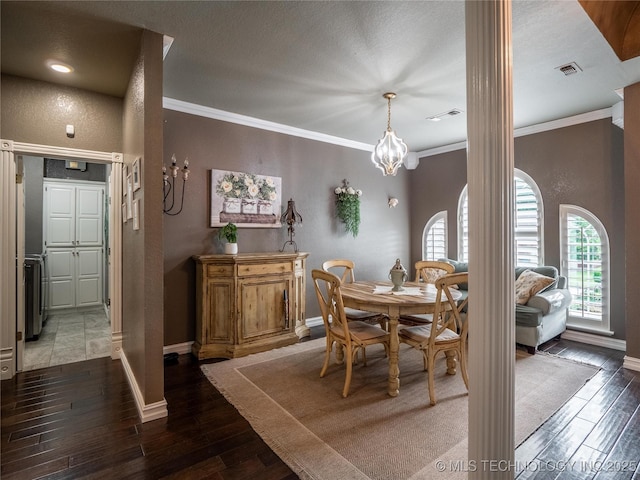 1904 Sandpiper St, Mcalester, OK 74501 - dining space featuring wood-type flooring, visible vents, ornamental molding, and baseboards