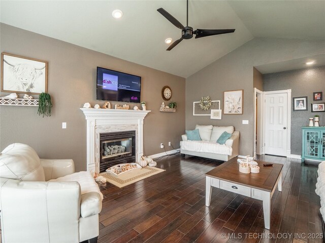 1904 Sandpiper St, Mcalester, OK 74501 - living area featuring wood finished floors, ceiling fan, a fireplace, baseboards, and high vaulted ceiling