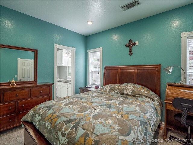 1904 Sandpiper St, Mcalester, OK 74501 - bedroom with visible vents and ensuite bathroom