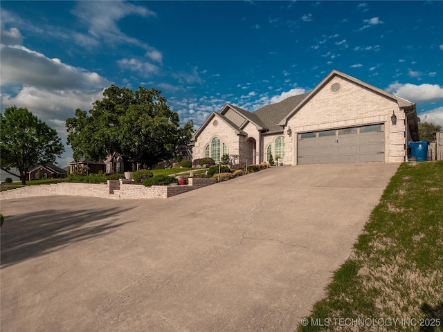 1904 Sandpiper St, Mcalester, OK 74501 - single story home featuring concrete driveway, an attached garage, and brick siding