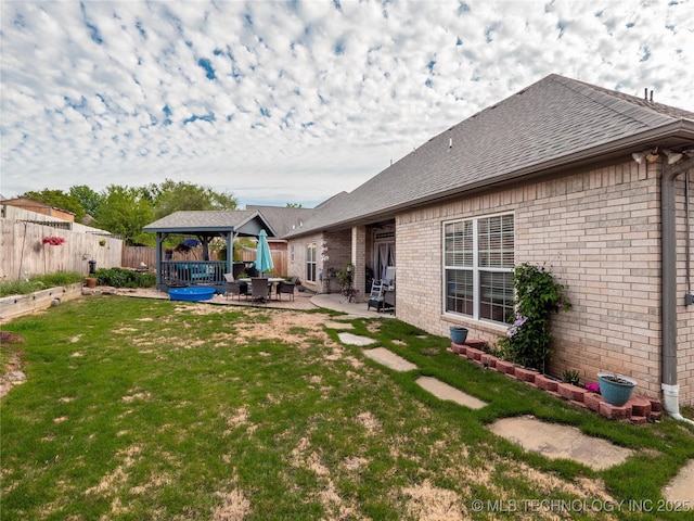 1904 Sandpiper St, Mcalester, OK 74501 - rear view of property with a gazebo, a patio, brick siding, and a fenced backyard