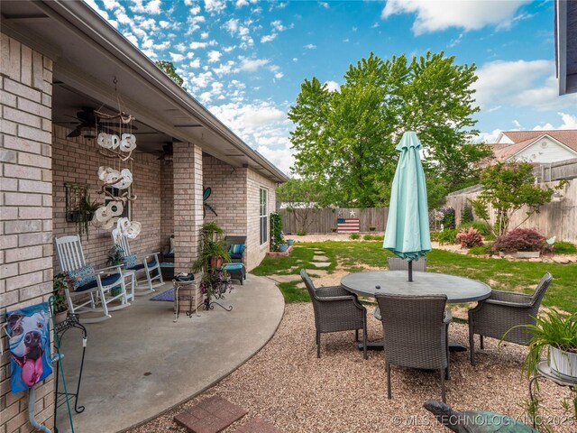 1904 Sandpiper St, Mcalester, OK 74501 - view of patio with outdoor dining area and a fenced backyard