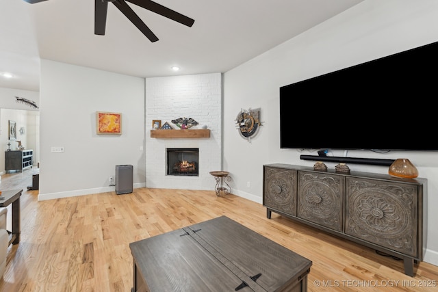 9218 N 141st E Ave, Owasso, OK 74055 - living area with recessed lighting, a ceiling fan, light wood finished floors, and a fireplace