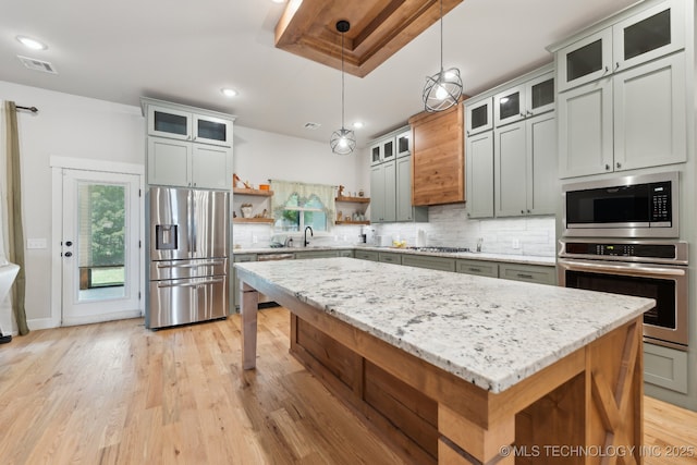 9218 N 141st E Ave, Owasso, OK 74055 - kitchen with a sink, decorative backsplash, open shelves, a center island, and appliances with stainless steel finishes