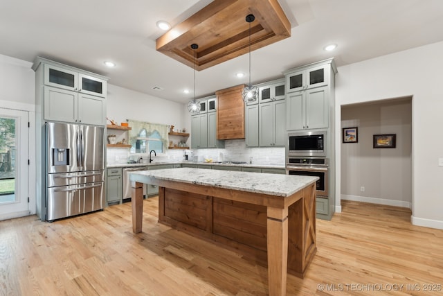 9218 N 141st E Ave, Owasso, OK 74055 - kitchen with recessed lighting, decorative backsplash, stainless steel appliances, open shelves, and a center island