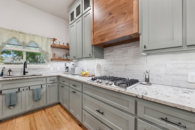 9218 N 141st E Ave, Owasso, OK 74055 - kitchen featuring a sink, stainless steel gas stovetop, custom range hood, backsplash, and gray cabinetry