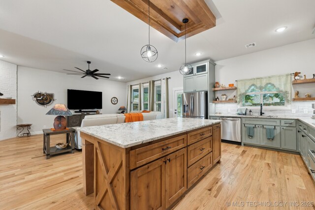 9218 N 141st E Ave, Owasso, OK 74055 - kitchen featuring visible vents, stainless steel appliances, open shelves, and a sink