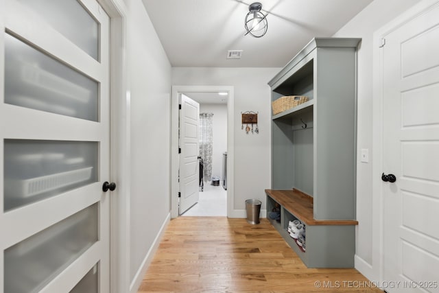 9218 N 141st E Ave, Owasso, OK 74055 - mudroom featuring visible vents, light wood-style flooring, and baseboards