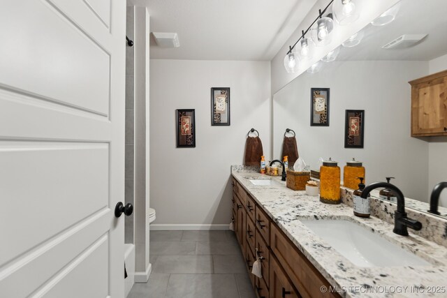 9218 N 141st E Ave, Owasso, OK 74055 - full bathroom featuring tile patterned flooring, a sink, double vanity, and baseboards