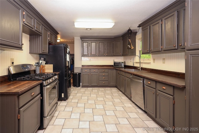 9585 Celia Berryhill Rd, Okmulgee, OK 74447 - kitchen featuring stainless steel appliances, butcher block counters, and light flooring