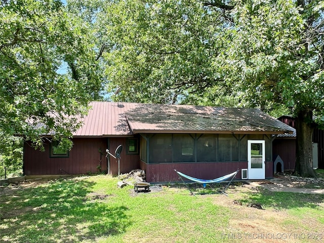 9585 Celia Berryhill Rd, Okmulgee, OK 74447 - rear view of house with a yard and a metal roof