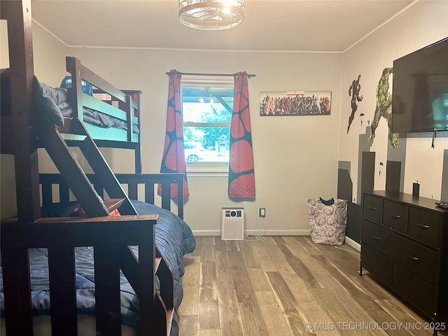 9585 Celia Berryhill Rd, Okmulgee, OK 74447 - bedroom with wood finished floors and crown molding