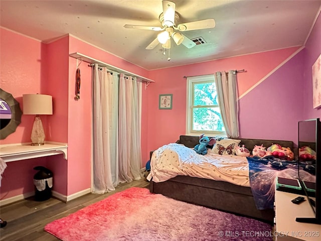 9585 Celia Berryhill Rd, Okmulgee, OK 74447 - bedroom featuring wood finished floors and a ceiling fan